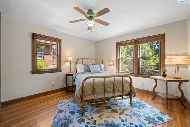 1005 NW State St, Pullman, WA 99163 - bedroom with wood finished floors, baseboards, and a ceiling fan
