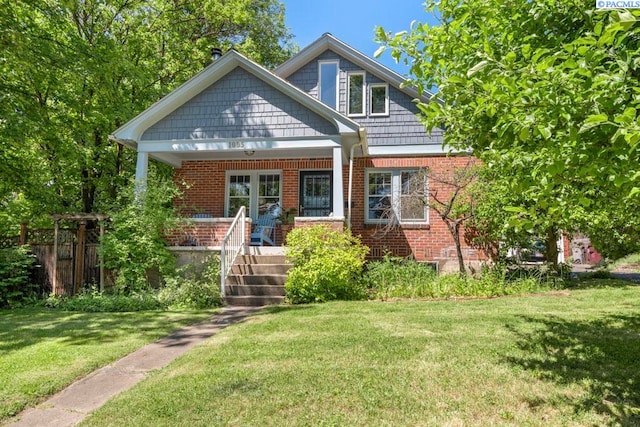1005 NW State St, Pullman, WA 99163 - view of front facade with brick siding and covered porch