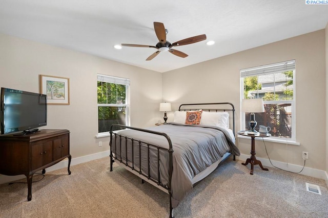 1005 NW State St, Pullman, WA 99163 - carpeted bedroom featuring multiple windows, baseboards, a ceiling fan, and recessed lighting