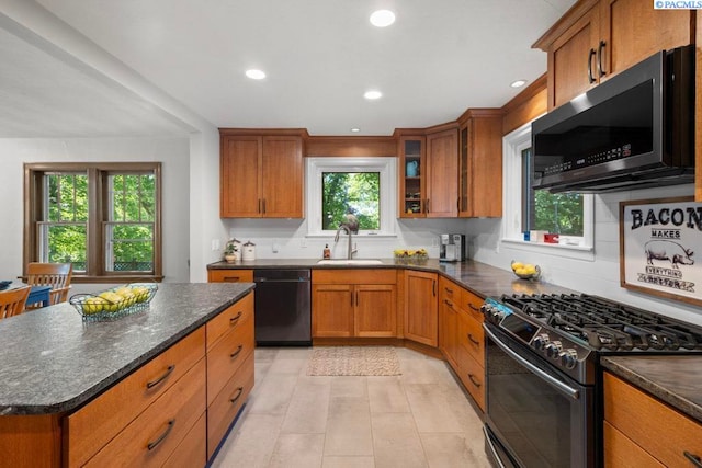 1005 NW State St, Pullman, WA 99163 - kitchen with black appliances, a sink, brown cabinetry, and recessed lighting