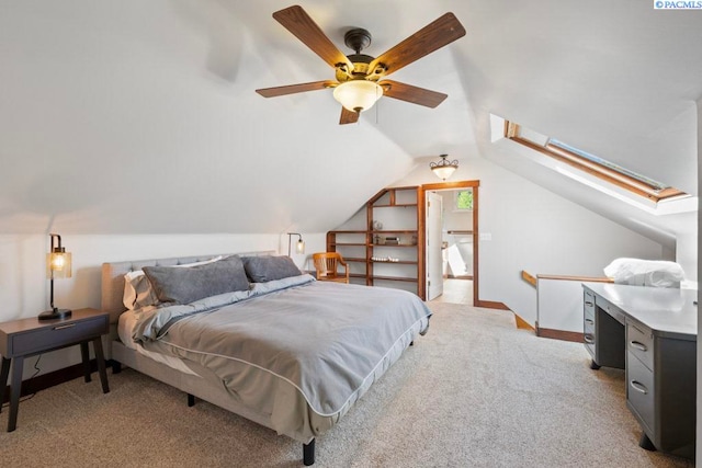 1005 NW State St, Pullman, WA 99163 - bedroom featuring light carpet, a skylight, lofted ceiling, and a ceiling fan