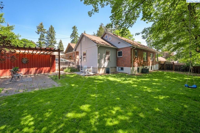 1005 NW State St, Pullman, WA 99163 - back of house with brick siding and a patio area