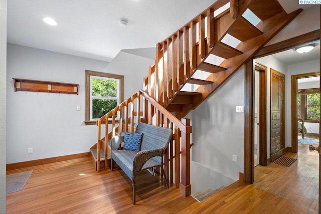 1005 NW State St, Pullman, WA 99163 - stairs with wood finished floors, baseboards, plenty of natural light, and recessed lighting