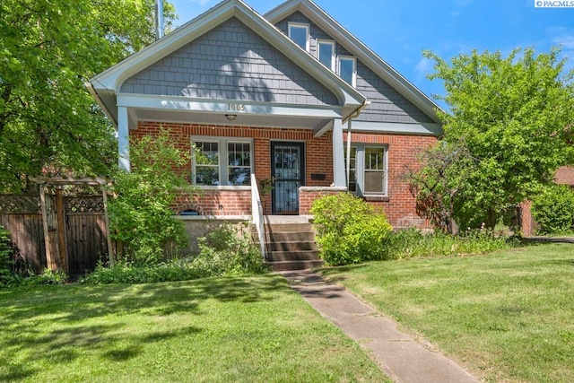 1005 NW State St, Pullman, WA 99163 - view of front of house with brick siding and a porch