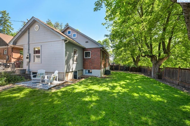 1005 NW State St, Pullman, WA 99163 - back of property with a patio and brick siding