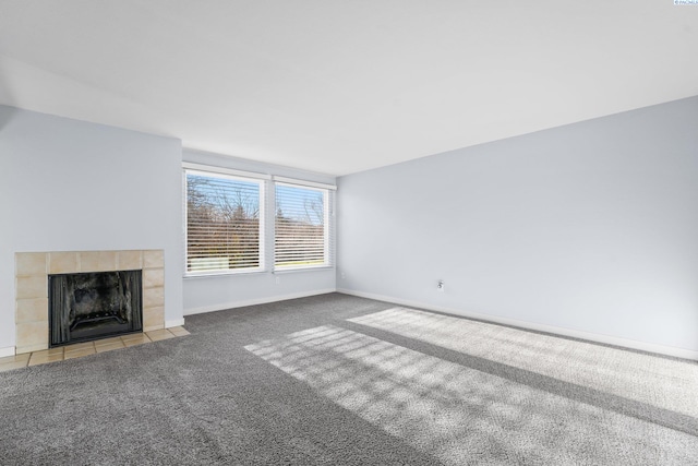 303 Gage Blvd Unit 122, Richland, WA 99352 - unfurnished living room with carpet, baseboards, and a tiled fireplace