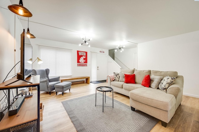 living room featuring stairs and wood finished floors