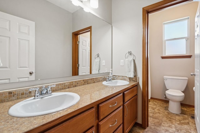 8712 W 9th Ave, Kennewick, WA 99336 - bathroom featuring double vanity and decorative backsplash