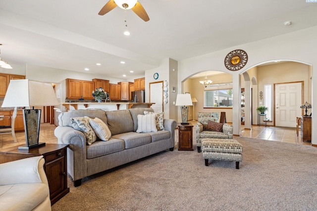 8712 W 9th Ave, Kennewick, WA 99336 - living room with arched walkways, light carpet, a chandelier, recessed lighting, and ceiling fan
