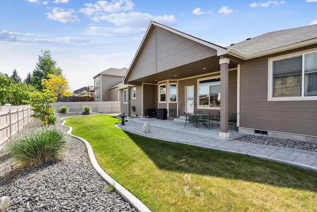 8712 W 9th Ave, Kennewick, WA 99336 - rear view of property featuring a fenced backyard and a patio area