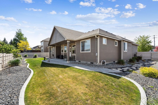 8712 W 9th Ave, Kennewick, WA 99336 - rear view of property featuring a patio and a fenced backyard