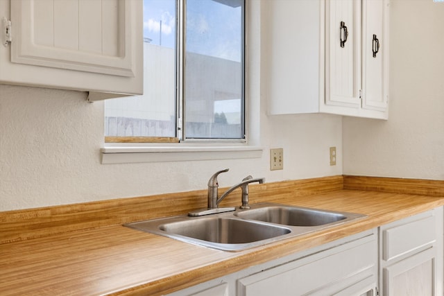 kitchen with sink and white cabinets