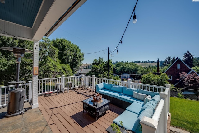 wooden deck featuring an outdoor hangout area and a lawn