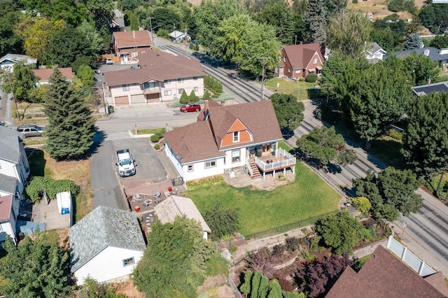 birds eye view of property with a residential view