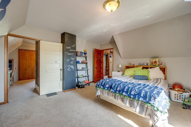 bedroom featuring vaulted ceiling, carpet, and baseboards