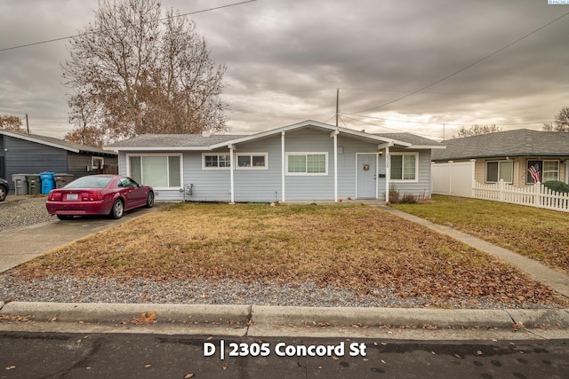 ranch-style home with a front yard