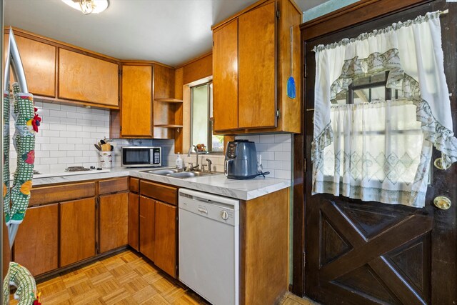 506 S Zillah St, Kennewick, WA 99336 - kitchen with dishwasher, stainless steel microwave, a sink, open shelves, and light countertops