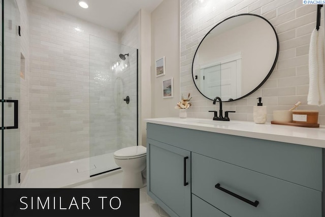 bathroom with vanity, toilet, an enclosed shower, and decorative backsplash