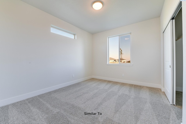 6482 W 30th Pl, Kennewick, WA 99338 - unfurnished bedroom featuring light colored carpet, baseboards, and a closet