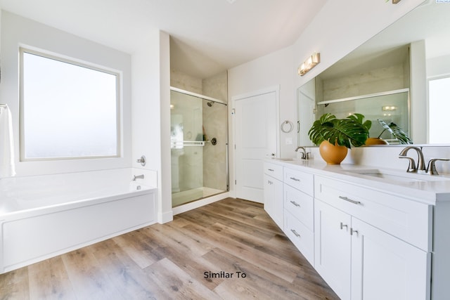 6482 W 30th Pl, Kennewick, WA 99338 - full bathroom featuring a stall shower, a bath, double vanity, and wood finished floors
