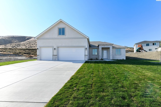 6482 W 30th Pl, Kennewick, WA 99338 - view of front of home with stucco siding, a front lawn, stone siding, concrete driveway, and a garage