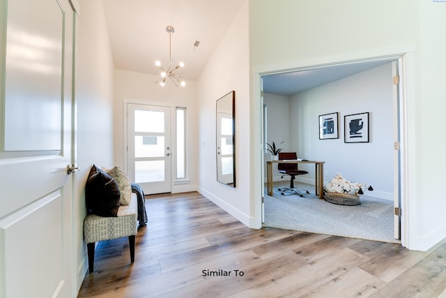 6482 W 30th Pl, Kennewick, WA 99338 - entryway featuring a chandelier, wood finished floors, lofted ceiling, and baseboards