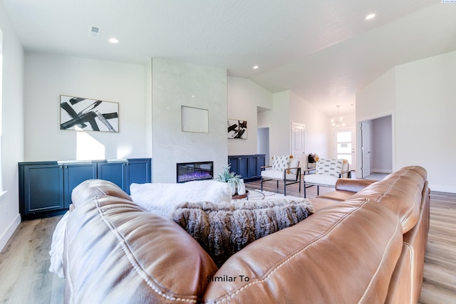 6482 W 30th Pl, Kennewick, WA 99338 - living room with light wood-type flooring, a fireplace, lofted ceiling, baseboards, and recessed lighting