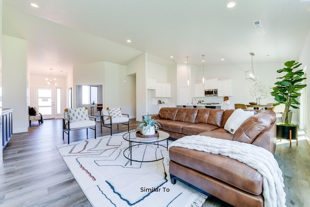 6482 W 30th Pl, Kennewick, WA 99338 - living room featuring light wood finished floors, recessed lighting, baseboards, and lofted ceiling