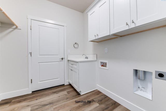 6482 W 30th Pl, Kennewick, WA 99338 - laundry room featuring hookup for an electric dryer, cabinet space, hookup for a washing machine, wood finished floors, and baseboards