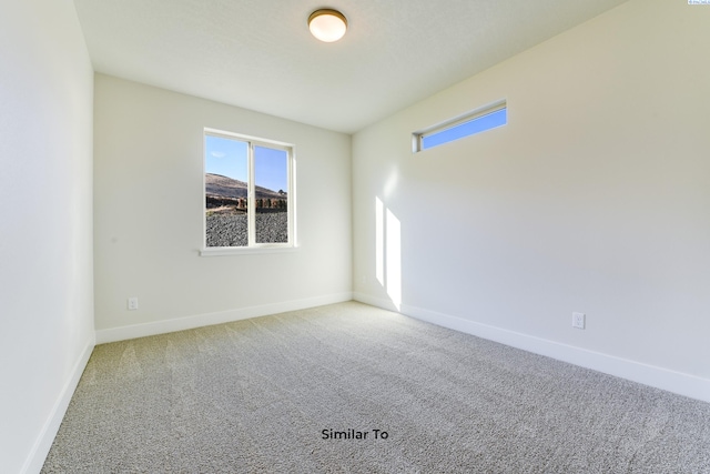 6482 W 30th Pl, Kennewick, WA 99338 - carpeted spare room with plenty of natural light and baseboards