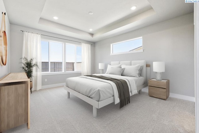 2895 Avrio Ave, Richland, WA 99354 - bedroom featuring light carpet, baseboards, and a raised ceiling