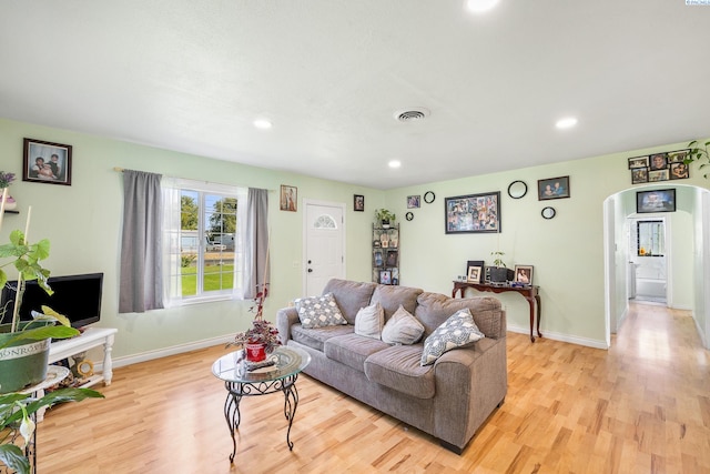 living room with light hardwood / wood-style flooring