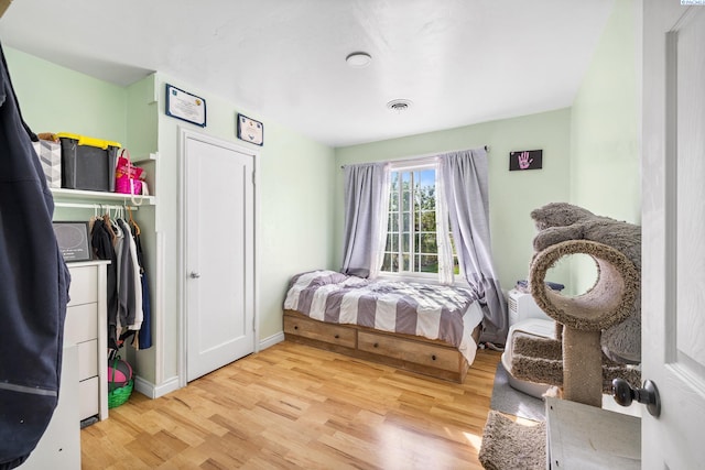 bedroom with light hardwood / wood-style flooring