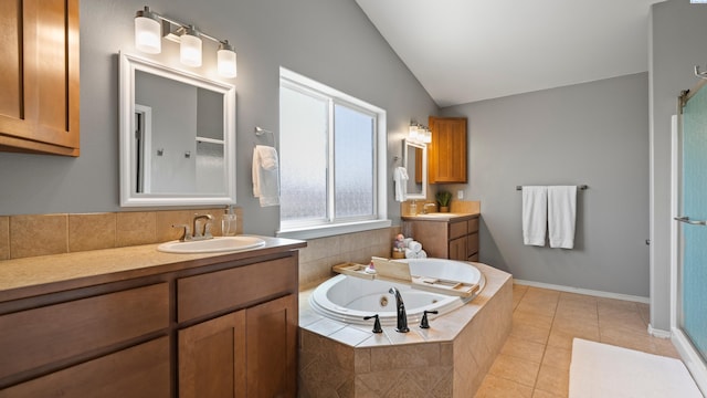 1824 W 28th Ave, Kennewick, WA 99337 - full bath with lofted ceiling, a whirlpool tub, two vanities, tile patterned flooring, and walk in shower