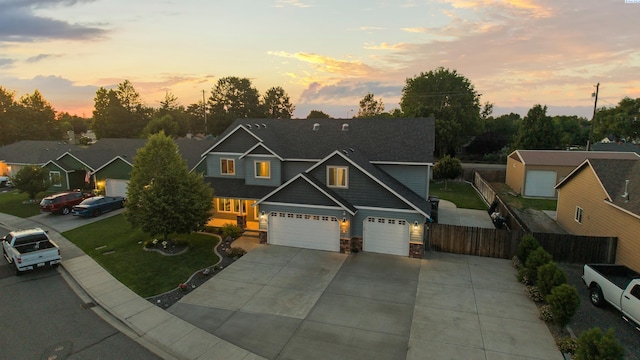 1824 W 28th Ave, Kennewick, WA 99337 - craftsman house featuring concrete driveway, stone siding, and an attached garage
