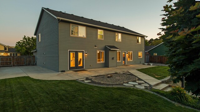 1824 W 28th Ave, Kennewick, WA 99337 - back of property featuring a patio area, a fenced backyard, and french doors