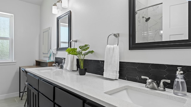 1824 W 28th Ave, Kennewick, WA 99337 - bathroom with a marble finish shower, double vanity, decorative backsplash, and plenty of natural light