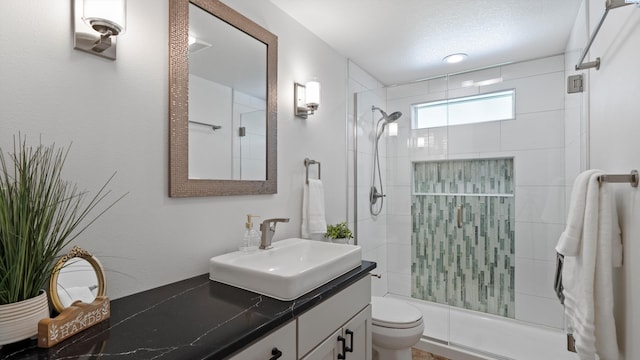 654 Cottonwood Dr, Richland, WA 99352 - bathroom featuring vanity, toilet, and a shower with door