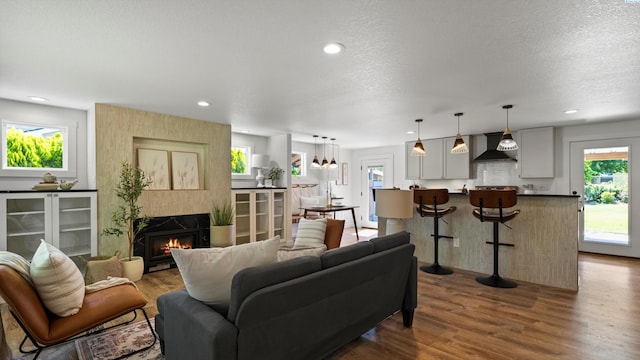 654 Cottonwood Dr, Richland, WA 99352 - living room with plenty of natural light, a high end fireplace, dark wood-style floors, recessed lighting, and a textured ceiling