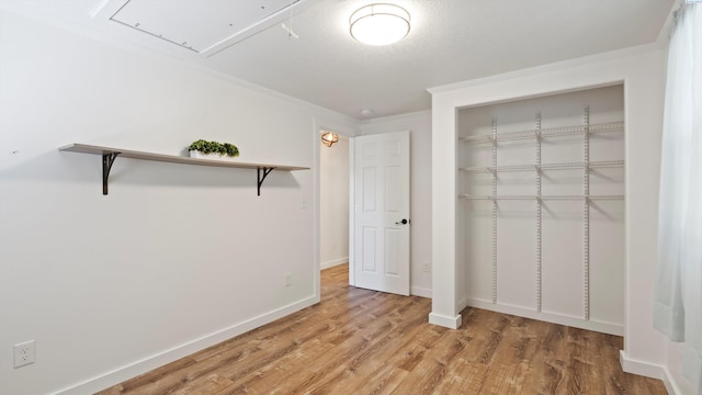 654 Cottonwood Dr, Richland, WA 99352 - unfurnished bedroom with attic access, a closet, light wood-type flooring, and baseboards