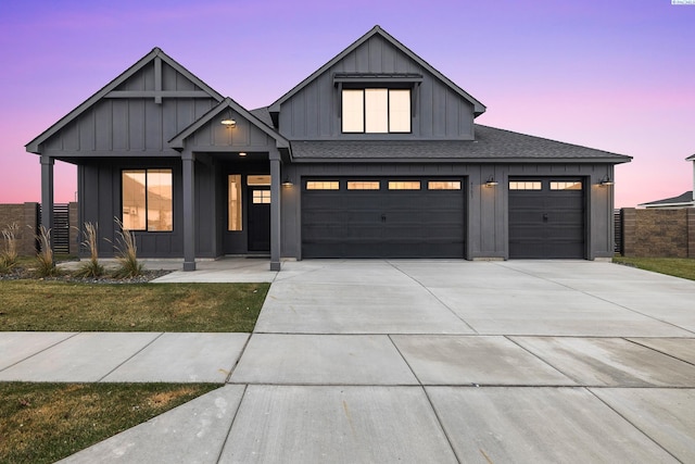 modern inspired farmhouse with a garage