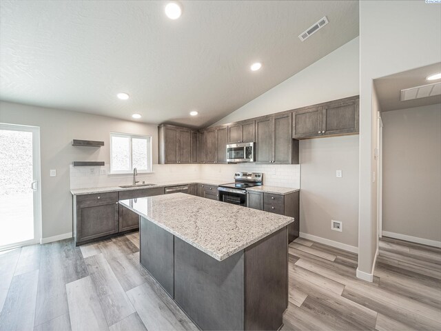 1600 SW Kelandren Dr, Prosser, WA 99350 - kitchen featuring stainless steel appliances, a sink, open shelves, recessed lighting, and a kitchen island