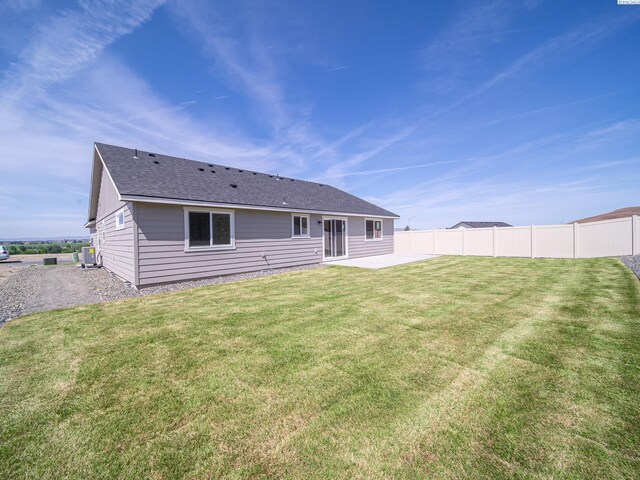 1600 SW Kelandren Dr, Prosser, WA 99350 - rear view of house with a patio, central AC, and roof with shingles