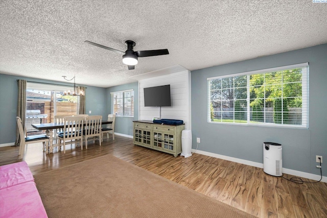 2519 W Grand Rhonde Pl, Kennewick, WA 99336 - living area featuring wood finished floors, ceiling fan, baseboards, and a textured ceiling