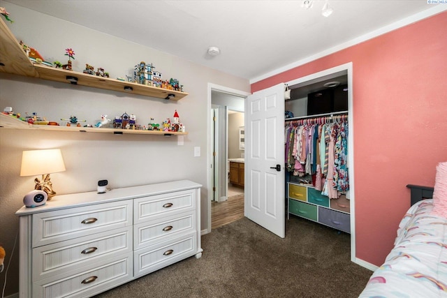2519 W Grand Rhonde Pl, Kennewick, WA 99336 - bedroom with a closet, dark colored carpet, and baseboards