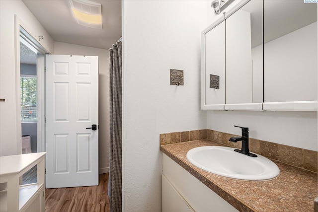 2519 W Grand Rhonde Pl, Kennewick, WA 99336 - bathroom featuring vanity and wood finished floors