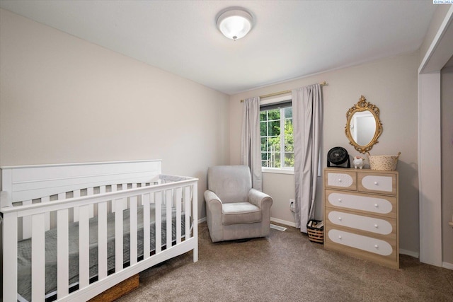 2519 W Grand Rhonde Pl, Kennewick, WA 99336 - carpeted bedroom featuring baseboards and a crib