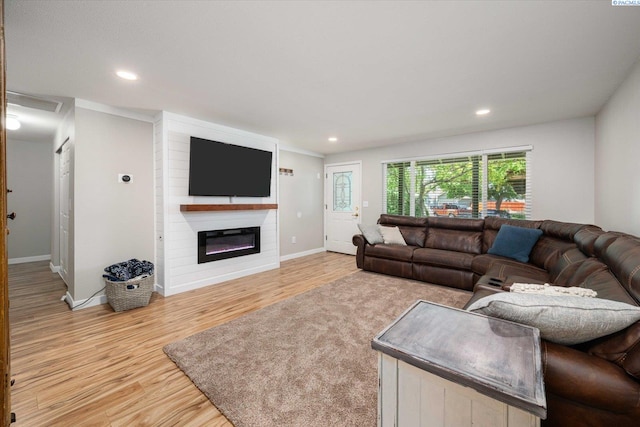 2519 W Grand Rhonde Pl, Kennewick, WA 99336 - living room with light wood-type flooring, a glass covered fireplace, baseboards, and recessed lighting