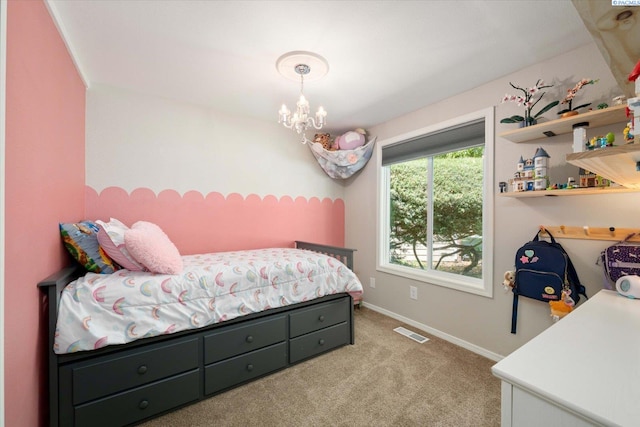 2519 W Grand Rhonde Pl, Kennewick, WA 99336 - carpeted bedroom featuring a chandelier and baseboards