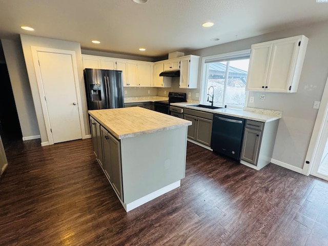 kitchen featuring sink, white cabinetry, gray cabinetry, a center island, and black appliances